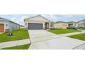 Lovely one-story home featuring a two-car garage, set in a peaceful residential neighborhood with sidewalk at 33332 Seattle Slew Dr, Sorrento, FL 32776
