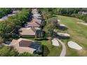 Golf course community with beautiful homes, mature trees, and a tranquil pond with a walking path at 3400 Park Grove Ct, Longwood, FL 32779