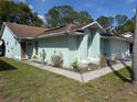 This home boasts a well-manicured lawn and beautiful curb appeal at 4798 Windwood Dr, Kissimmee, FL 34746