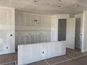 Unfinished kitchen space with visible stud walls and taped drywall, ready for customization at 1013 Alabaster Way, Deltona, FL 32725