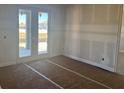 A view of an unfinished room featuring a sliding glass door to the outside at 1013 Alabaster Way, Deltona, FL 32725
