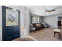 Inviting living room with large windows, a ceiling fan, and comfortable seating at 104 Cambridge Dr, Longwood, FL 32779