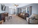 Living room featuring a flat screen TV, piano, and lots of natural light at 104 Cambridge Dr, Longwood, FL 32779