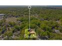 Aerial view of a secluded property surrounded by lush green trees, providing privacy and tranquility at 1120 Sheeler Ave, Apopka, FL 32703