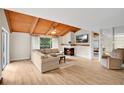 Cozy living room featuring a fireplace, wood ceiling and plush sofa at 122 Spreading Oak Ct, Sanford, FL 32773