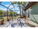 Relaxing screened patio with outdoor seating and view of the backyard at 1510 Chatsworth Ave, Deltona, FL 32738