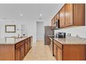 Spacious kitchen with granite countertops, stainless steel appliances, and tile flooring at 1932 Red Canyon Dr, Kissimmee, FL 34744