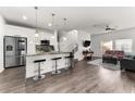 Bright and open living space with sleek marble countertops and stainless steel appliances at 4761 Ormond Beach Way, Kissimmee, FL 34746