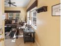 Comfortable living room featuring neutral tones, ceiling fan, and natural light at 4772 Vero Beach Pl, Kissimmee, FL 34746