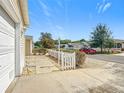 Street view showcases the home's location in a well-maintained neighborhood with manicured lawns at 480 Hildalgo Dr, The Villages, FL 32159