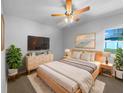 Cozy bedroom featuring a neutral color palette, stylish decor, and a ceiling fan at 6 Almond Trce, Ocala, FL 34472