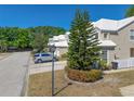 Exterior of a cozy home with mature landscaping, set on a tree-lined street at 6936 Della Dr # 33, Orlando, FL 32819