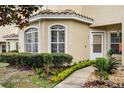 Home exterior with manicured landscaping, sidewalk, and covered entryway at 696 Seabrook Ct # 101, Altamonte Springs, FL 32714