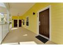 Inviting yellow hallway leading to unit 806, with a clean and well-maintained appearance at 806 Lucaya Loop, Davenport, FL 33897