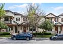 Inviting townhouse exteriors featuring balconies and lush landscaping, perfect for modern living at 10655 Village Lake Rd, Windermere, FL 34786