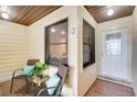Cozy covered front porch with comfortable seating, creating a relaxing outdoor entryway at 1148 Monroe Ave, St Cloud, FL 34769