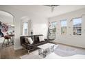 Bright living room with modern decor, stylish seating, and views from multiple windows at 12016 Villanova Dr # 101, Orlando, FL 32837