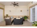 Comfortable covered patio with ceiling fan, cushioned seating, and pleasant decorative touches at 13326 Fountainbleau Dr, Clermont, FL 34711
