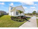 Attractive home showcasing lush landscaping with a vibrant green lawn and healthy shrubs at 15060 Brodie Ln, Winter Garden, FL 34787