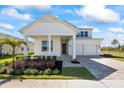 Charming two-story home with a well-manicured lawn, stylish landscaping, and a welcoming front porch at 15060 Brodie Ln, Winter Garden, FL 34787