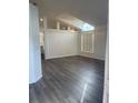 Bright living room featuring hardwood flooring and lots of natural light at 15746 Autumn Glen Ave, Clermont, FL 34714