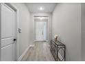 Inviting entryway with light floors and a decorative table, creating a welcoming atmosphere at 19318 Banfield Pl, Orlando, FL 32827