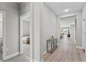 Bright hallway with light floors, connecting various rooms in the home at 19318 Banfield Pl, Orlando, FL 32827