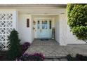 Inviting entryway with light blue door, decorative glass, and tiled porch at 2510 Kiowa Trl, Fern Park, FL 32730