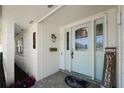 Covered entryway with stylish front door, sidelights and a 'welcome' sign at 2510 Kiowa Trl, Fern Park, FL 32730