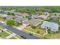 Suburban neighborhood showcasing well-maintained homes, mature trees, and neatly landscaped yards at 2877 Ashton Ter, Oviedo, FL 32765