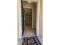 Open doorway revealing a tiled foyer and glimpse into the spacious, light-filled interior of the home at 3433 Soho St # 101, Orlando, FL 32835