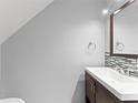 Powder bath features a modern vanity with a decorative backsplash and updated fixtures at 435 Tradition Ln, Winter Springs, FL 32708