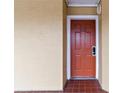 Condo unit 4204 has a red front door with white trim and is set in a textured beige stucco wall at 6403 Parc Corniche Dr # 4204, Orlando, FL 32821