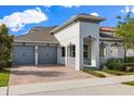 Attractive single-Gathering home with a brick driveway, a two-car garage and landscaped yard at 778 Gainer Way, Winter Springs, FL 32708