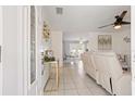 Inviting foyer with neutral tile flooring and decorative accents creates a warm first impression at 825 Keats Ave, Orlando, FL 32809