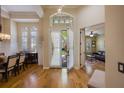 Inviting foyer with hardwood floors and arched doorways leading to living areas at 8912 Heritage Bay Cir, Orlando, FL 32836
