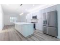 Modern kitchen featuring a large island, stainless steel appliances, and open layout for entertaining and cooking at 113 Golden Crest Ct, Winter Springs, FL 32708