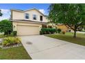 Charming two-story home with a spacious driveway and meticulously landscaped front yard at 1304 Independence Ln, Mount Dora, FL 32757