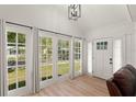 Bright sunroom featuring hardwood floors, neutral paint and many windows at 1638 Mount Vernon St, Orlando, FL 32803