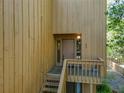 Townhome entrance featuring a staircase leading up to the front door and a small side window at 225 Crown Oaks Way, Longwood, FL 32779