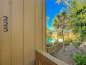 A community swimming pool is seen from a townhome's porch, offering a relaxing and recreational space at 225 Crown Oaks Way, Longwood, FL 32779