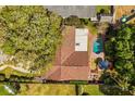 Aerial view of a home with a pool, well-maintained landscaping, and a spacious backyard at 2508 Osage Trl, Fern Park, FL 32730