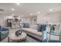 Bright living room with stylish decor, plenty of seating, and an open layout at 307 Corsica Ct, Kissimmee, FL 34758