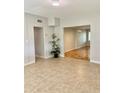 Inviting living room featuring tile floors and easy access to additional rooms at 3214 Debbie Dr, Orlando, FL 32806