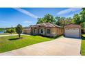 Single Gathering home with a three car garage, well maintained lawn, and detached garage at 475 Pitt St, Clermont, FL 34711