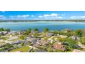 Desirable neighborhood with waterfront access, showcasing lush landscaping and well-kept homes at 5263 Jade Cir, Belle Isle, FL 32812