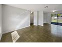 Spacious room with neutral walls and tile flooring, ready for your personal touch at 5618 Carris Ct, Orlando, FL 32810