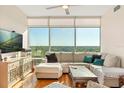 Inviting living room with a comfortable sofa, scenic views, and stylish decor at 101 S Eola Dr # 902, Orlando, FL 32801