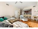 Cozy living room with hardwood floors, modern furniture, and an open layout at 101 S Eola Dr # 902, Orlando, FL 32801