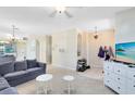 Open-concept living room offering a smooth transition into tiled entry area, creating an inviting living space at 14230 Sunriver Ave, Orlando, FL 32828